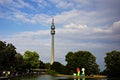 Tower of the Westfalenpark surrounded by trees and water in Dortmund, Germany