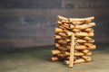 Tower of whole sticks of fragrant cinnamon on a wooden rural table. copyspace. composition of seasoning and slide flavoring