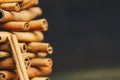 Tower of whole sticks of fragrant cinnamon on a wooden rural table. copyspace. composition of seasoning and slide flavoring