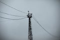 Tower with wires. Tower on the background of the sky. High Steel Tower