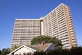 Towering Apartment Building Against Bright Blue Sky Royalty Free Stock Photo