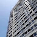 The towering apartment building seen from the bottom side. Royalty Free Stock Photo