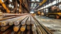 A towering arrangement of steel bars sits in a warehouse, each beam creating a harmonious display of strength and structure