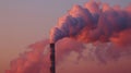 A towering chimney releasing hot polluted air as a byproduct of the energy production process Royalty Free Stock Photo