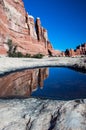 Towering cliffs with reflection from pothole Royalty Free Stock Photo