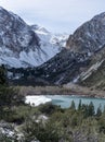 The towering Easter Sierra rises behind the freezing Parker Lake