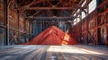 A towering heap of vibrant red dirt fills the warehouse, awaiting processing for potent potash fertilizers
