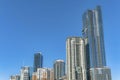 Towering modern luxury apartments against blue sky background on a sunny day Royalty Free Stock Photo