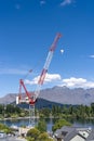 Towering Red Crane Overlooking Lake Wakatipu in Queenstown, New Zealand