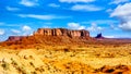 The towering red sandstone formations of Sentinel Mesa and Stagecoach Butte in Navajo Nation`s Monument Valley Navajo Tribal Park