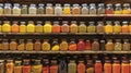 Towering shelves stacked with jars of es in a rainbow of colors ranging from fiery red chili flakes to earthy golden