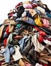 A towering pile of old used clothes symbolizes recycling, climate change awareness and sustainable fashion. It underscores the Royalty Free Stock Photo