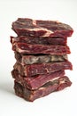 Towering stack of premium cured meat slices on white background Royalty Free Stock Photo