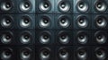A towering stack of professional subwoofers, arranged in a grid pattern