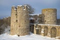 Towers and bridge of medieval fortress of Koporye close up in the cloudy February afternoon. Leningrad region, Russia Royalty Free Stock Photo