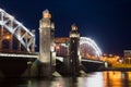 The towers of the bridge of Peter the Great in night illumination night in June. Saint Petersburg Royalty Free Stock Photo