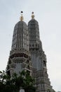 The towers of the Buddhist temple Wat Arun against the evening sky in Bangkok Royalty Free Stock Photo