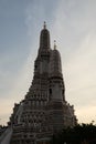 The towers of the Buddhist temple Wat Arun against the evening sky in Bangkok Royalty Free Stock Photo