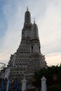 The towers of the Buddhist temple Wat Arun against the evening sky in Bangkok Royalty Free Stock Photo