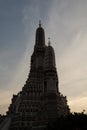 The towers of the Buddhist temple Wat Arun against the evening sky in Bangkok