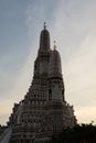 The towers of the Buddhist temple Wat Arun against the evening sky in Bangkok