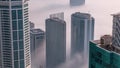 Rare early morning winter fog above the Dubai Marina skyline and skyscrapers rooftops aerial timelapse. Royalty Free Stock Photo