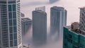 Rare early morning winter fog above the Dubai Marina skyline and skyscrapers rooftops aerial . Royalty Free Stock Photo