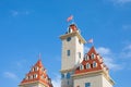 Towers of a decorative castle, exterior of the new Dreamisland in Moscow amusement park. High main tower against a clear blue sky Royalty Free Stock Photo