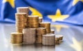 Towers with euro coins and flag of European Union in the background