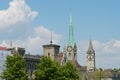 The towers of FrauenmÃÂ¼nster Church and St. Peter`s Church, the surrounding buildings and vegetations - trees with green foliage