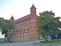 Towers of the Knight`s Castle of the Teutonic Order on a summer evening. Gnev, Poland