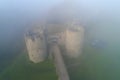 Towers of the Koporye fortress, morning mist. Leningrad region, Russia Royalty Free Stock Photo