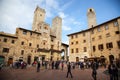 Towers and medieval well on Piazza della Cisterna in San Gimignano in tuscany in italy Royalty Free Stock Photo