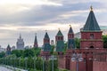 Towers of Moscow Kremlin along Kremlevskaya embankment at sunset, Russia