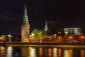 Towers of Moscow Kremlin on a background of Kremlevskaya embankment of Moskva river. Night landscape of Moscow historical center Royalty Free Stock Photo