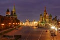 Towers of Moscow Kremlin and St. Basil Cathedral on Red Square with night illumination against dark blue sky Royalty Free Stock Photo