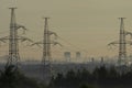 Towers of power lines in the pre-dawn fog Royalty Free Stock Photo