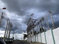 Towers and power poles on a city street Royalty Free Stock Photo