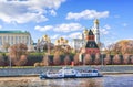 Towers and temples of the Kremlin and a pleasure ship on the Moskva River in Moscow Royalty Free Stock Photo