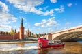 Towers of the Kremlin and a pleasure ship on the Moskva River in Moscow Royalty Free Stock Photo