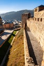 Towers, wall, moat and battlements of Ponferrada Castle at sunrise