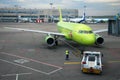 Towing aircraft Airbus A319 (VP-BTV) on the runway from the terminal at Domodedovo airport, Moscow