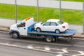 Towing service the tow truck with the loaded old damaged car which stopped working