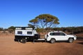 Towing vehicle and a caravan camping in the outback of Western Australia Royalty Free Stock Photo