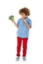 This town aint big enough for the both of us. Studio shot of a cute little boy pointing to broccoli against a white