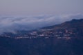 Town of Artenara at sunset and sea of clouds. Royalty Free Stock Photo