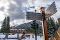 Town of Banff street signpost in snowy autumn day. Banff National Park