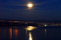 Town on the coast at night with moon Royalty Free Stock Photo