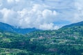 The town of Combloux in the mountain in the Mont Blanc Massif in Europe, France, the Alps, towards Chamonix, in summer, on a Royalty Free Stock Photo