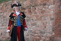 The Town Crier of Chester, England, with a brick wall in background